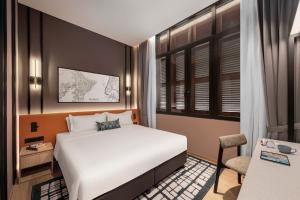 Postel nebo postele na pokoji v ubytování Citadines Connect Cecil Georgetown Penang