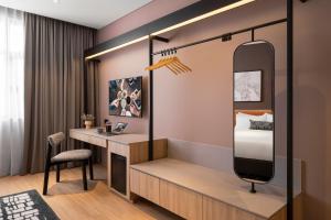Postel nebo postele na pokoji v ubytování Citadines Connect Cecil Georgetown Penang