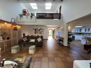 a large living room with a couch and a kitchen at Kabila Marina 2 Beach Haven - Your Coastal Escape in M'diq