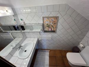 a bathroom with a sink and a toilet at Kabila Marina 2 Beach Haven - Your Coastal Escape in M'diq +56 photos