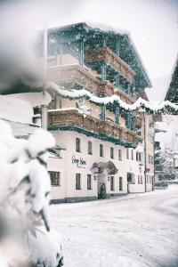 a large building in the snow with snow at Berg-Leben in Grossarl