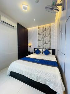 Postel nebo postele na pokoji v ubytování Phuc Hotel