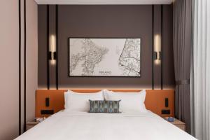 Postel nebo postele na pokoji v ubytování Citadines Connect Cecil Georgetown Penang