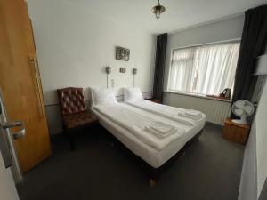 Postel nebo postele na pokoji v ubytování Amadeus Hotel