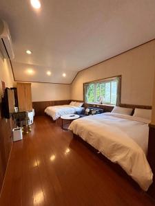 Postel nebo postele na pokoji v ubytování Star Coffee & Homestay