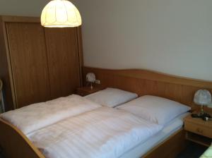 Postel nebo postele na pokoji v ubytování Gästehaus Schrötter