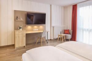 Postel nebo postele na pokoji v ubytování Hotel Zum Schiff