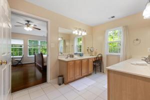 a bathroom with a sink and a mirror at Entire 4-BR in Beloved DC Area Takoma Park in Takoma Park +25 photos