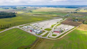 an aerial view of a parking lot in a field at Hotel Picaro Kopytkowo A1 in Kopytkowo