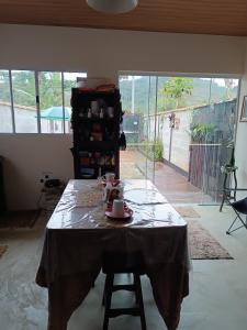 a table with a table cloth on it in a room at ALOHA#Sossego in Ubatuba