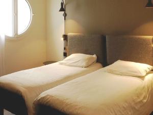 Postel nebo postele na pokoji v ubytování ibis Lille Centre Grand Place