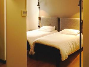 Postel nebo postele na pokoji v ubytování ibis Lille Centre Grand Place