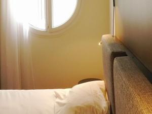 Postel nebo postele na pokoji v ubytování ibis Lille Centre Grand Place