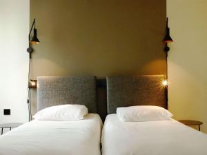 Postel nebo postele na pokoji v ubytování ibis Lille Centre Grand Place