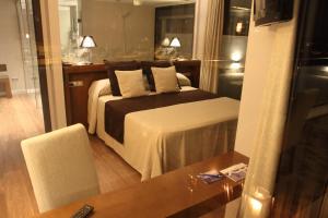 Postel nebo postele na pokoji v ubytování Hotel Don Paco