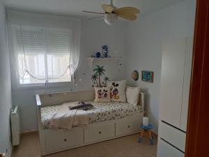 Ένα ή περισσότερα κρεβάτια σε δωμάτιο στο Ático El Racó de Carmen - Torreblanca