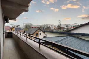 a balcony with a view of a city at Central Apartments - Green in Bacău