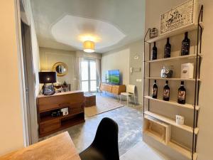 a living room with a shelf of wine bottles at Marty's House in Arezzo