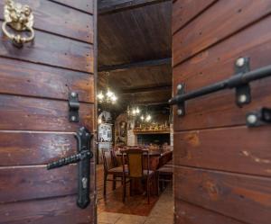 an open door to a restaurant with a table at Villa Štrkalj ZadarVillas in Murvica