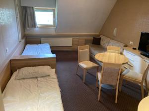 Ένα ή περισσότερα κρεβάτια σε δωμάτιο στο Ski centar konaci Kopaonik