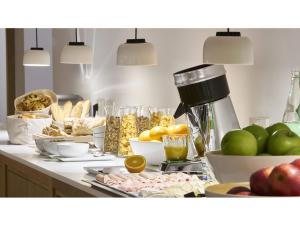 a kitchen counter with a bunch of food on it at 9Hotel Republique in Paris