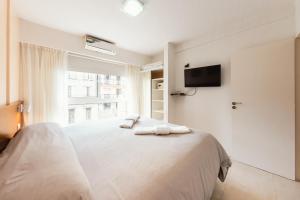 Le Batiment Apartments客房内的一张或多张床位