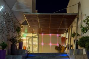 a building with purple lights on the wall at Park Beach Hotel in Limassol
