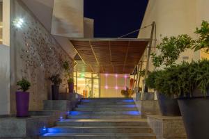 a staircase in a building with blue led lights at Park Beach Hotel in Limassol