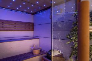 a room with a sauna with a plant in it at Park Beach Hotel in Limassol