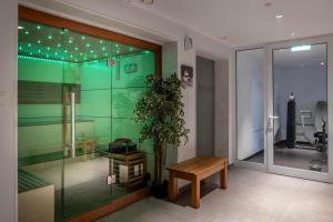 a room with a table and a potted plant at Park Beach Hotel in Limassol