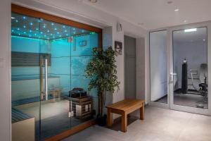 a room with a table and a potted plant at Park Beach Hotel in Limassol