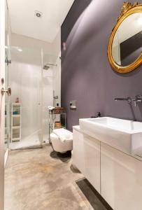 a bathroom with a white sink and a mirror at Historical Apartment Congress Center in Lisbon +25 photos