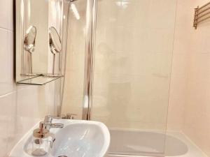 a bathroom with a sink and a shower at Le Family Palms Private Oasis with Terrace & BBQ in Playa Honda