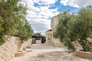 a house with a stone pathway leading to a building at House Anna in Drage