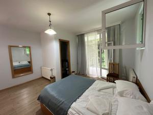 Postel nebo postele na pokoji v ubytování Nunisi Forest Hotel & SPA