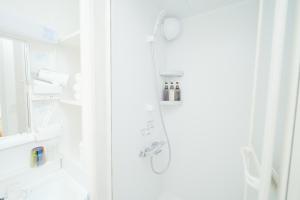 Koupelna v ubytování 東京リリアルホテル501 + 29 fotografií