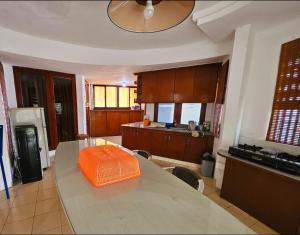 an orange box sitting on a table in a kitchen at Bella Villa Kota Bunga Puncak in Puncak