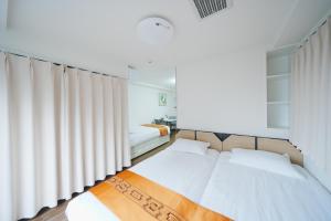 Postel nebo postele na pokoji v ubytování 東京リリアルホテル601