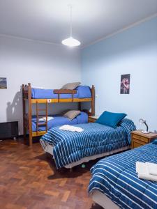 a room with two bunk beds in a room at El Oasis in Mendoza