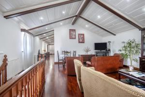 a living room with a couch and chairs at Bettencourt 2 Rooms in Santa Cruz da Graciosa