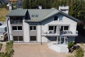 an aerial view of a white house at Krakstop apartamenty in Krakow
