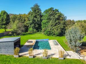 an aerial view of a garden with a swimming pool at Manoir d'Exception - 20 Personnes - Piscine, Baby-Foot & Tapis de Course in Coulaines