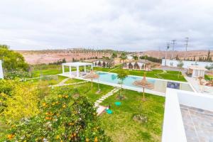 an overhead view of a garden with a swimming pool at L0ST Villa Marrakech in Marrakech