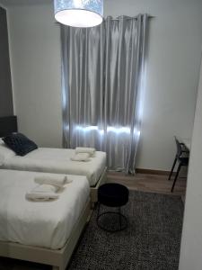 Postel nebo postele na pokoji v ubytování Residenza Novi