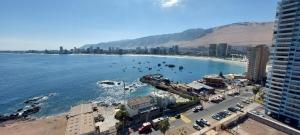 an aerial view of a beach with buildings and the ocean at Departamentos Nautilus in Iquique