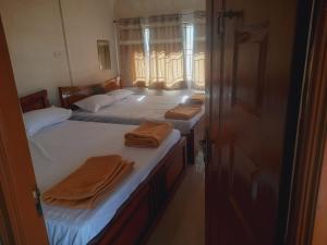 UDUPI YATHRINiVAS客房内的一张或多张床位