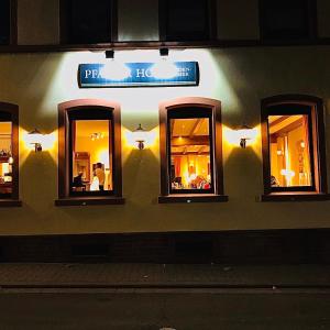 a group of mirrors on the side of a building at Hotel Pfälzer Hof in Enkenbach-Alsenborn