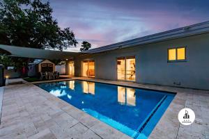 a swimming pool in the backyard of a house at Events Welcome - Upscale Venue - Pool, Valet & More in Miami