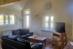 Μια τηλεόραση ή/και κέντρο ψυχαγωγίας στο 5 Abbey View cottages, Battle, East Sussex