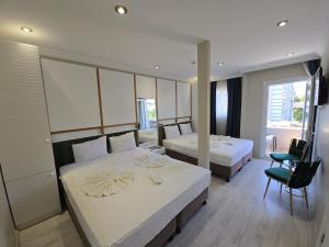 Postel nebo postele na pokoji v ubytování The Empress Theodora Hotel ll + 29 fotografií